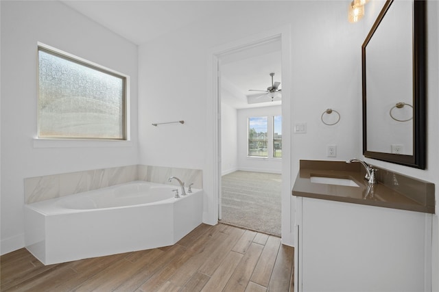 32646 Fly Fish Way, Fulshear, TX 77441 - full bathroom featuring vanity, wood finished floors, and a garden tub
