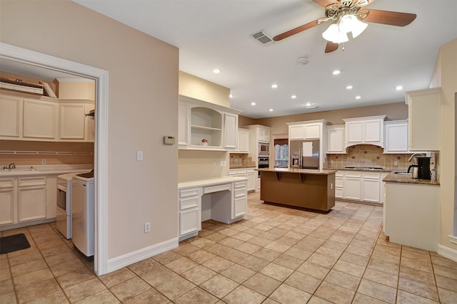 kitchen featuring visible vents, ceiling fan, stainless steel appliances, tasteful backsplash, and open shelves