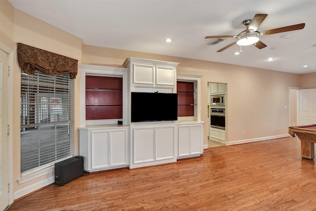unfurnished living room featuring visible vents, baseboards, ceiling fan, and light wood-type flooring