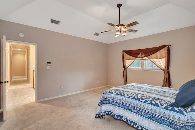 bedroom featuring baseboards, visible vents, vaulted ceiling, and attic access