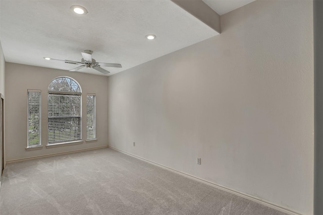 unfurnished room with baseboards, ceiling fan, recessed lighting, and light colored carpet