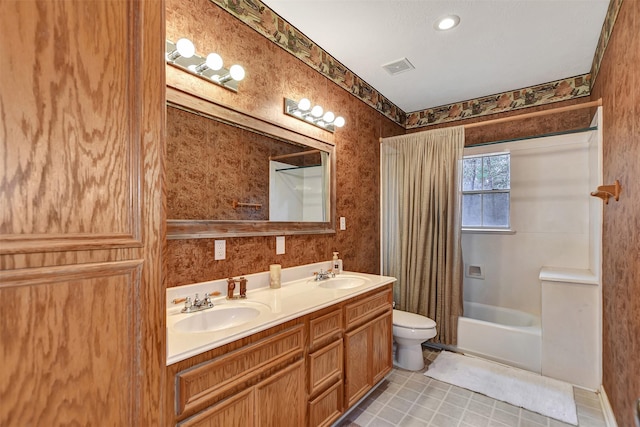 full bathroom with visible vents, toilet, shower / tub combo with curtain, and a sink