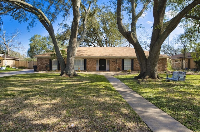 ranch-style house with a front lawn