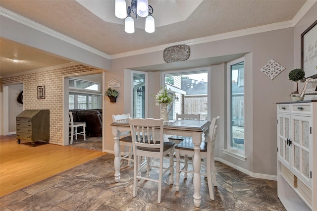 dining space with crown molding, wood-type flooring, and a textured ceiling