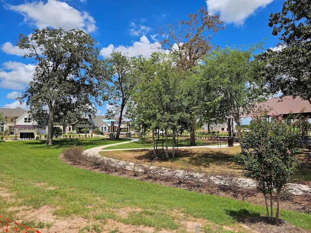 32650 Fly Fish Way, Fulshear, TX 77441 - view of home's community with a lawn