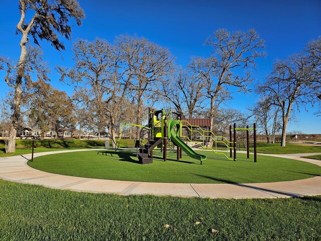 32650 Fly Fish Way, Fulshear, TX 77441 - communal playground featuring a lawn
