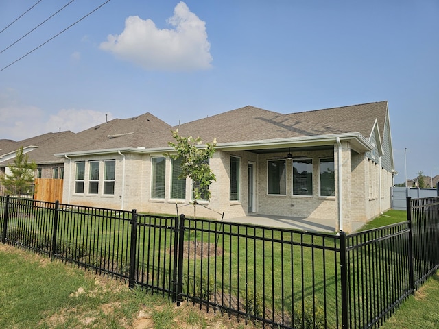 32650 Fly Fish Way, Fulshear, TX 77441 - back of property featuring brick siding and roof with shingles