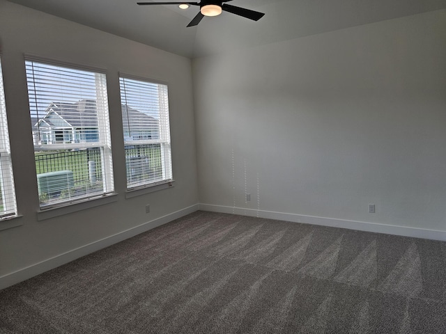 32650 Fly Fish Way, Fulshear, TX 77441 - empty room featuring dark carpet, ceiling fan, and baseboards