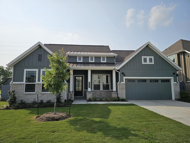 32650 Fly Fish Way, Fulshear, TX 77441 - craftsman inspired home with board and batten siding, driveway, an attached garage, a standing seam roof, and a front lawn