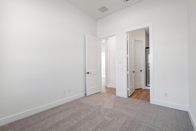 32650 Fly Fish Way, Fulshear, TX 77441 - unfurnished bedroom with light colored carpet and baseboards