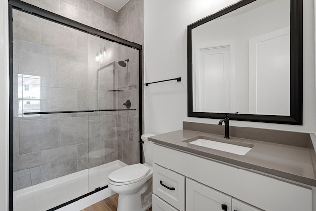 32650 Fly Fish Way, Fulshear, TX 77441 - full bathroom featuring a shower stall, vanity, and wood finished floors