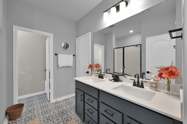 bathroom featuring vanity, tile patterned flooring, and walk in shower