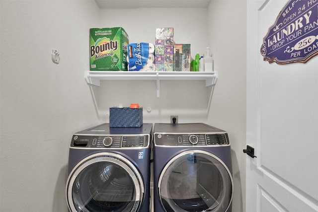 laundry area featuring washing machine and clothes dryer