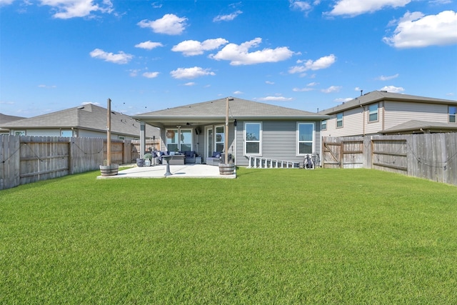 rear view of house featuring a patio and a yard