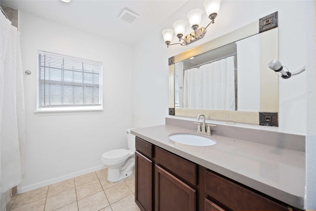 bathroom featuring tile patterned floors, toilet, and vanity