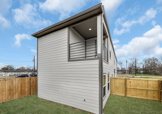 view of side of property with a yard