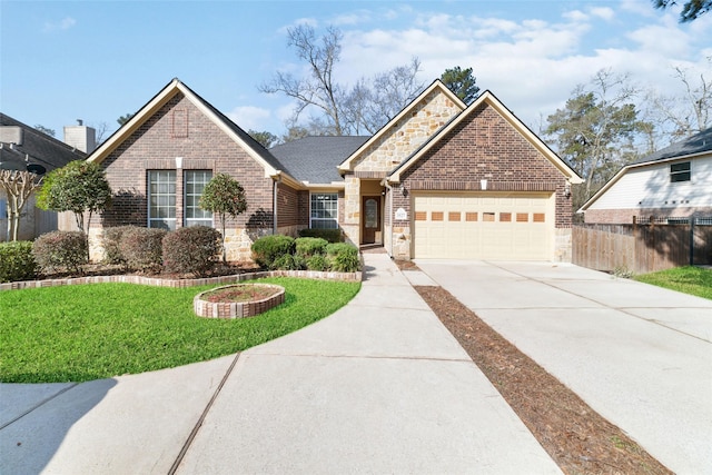 view of front of house featuring driveway, stone siding, and brick siding