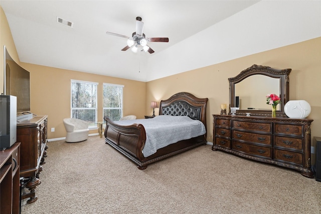 bedroom featuring baseboards, visible vents, light colored carpet, lofted ceiling, and ceiling fan