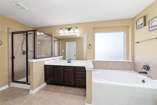 bathroom with visible vents, tile patterned flooring, vanity, a shower stall, and a bath