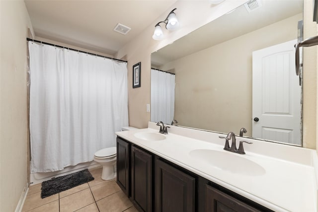 bathroom featuring a sink, visible vents, and tile patterned floors