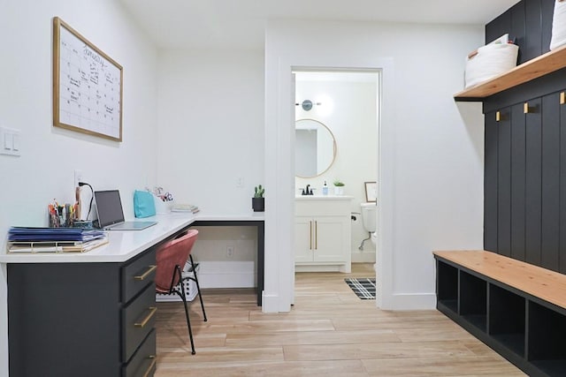 bathroom featuring hardwood / wood-style flooring and toilet