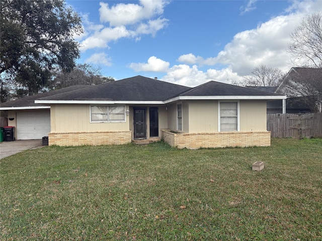 ranch-style home with a garage and a front yard