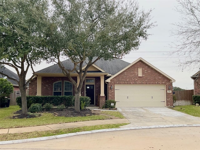 view of front of house with concrete driveway, brick siding, an attached garage, and fence