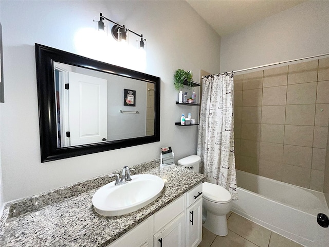 bathroom featuring toilet, shower / bath combo with shower curtain, vanity, and tile patterned floors