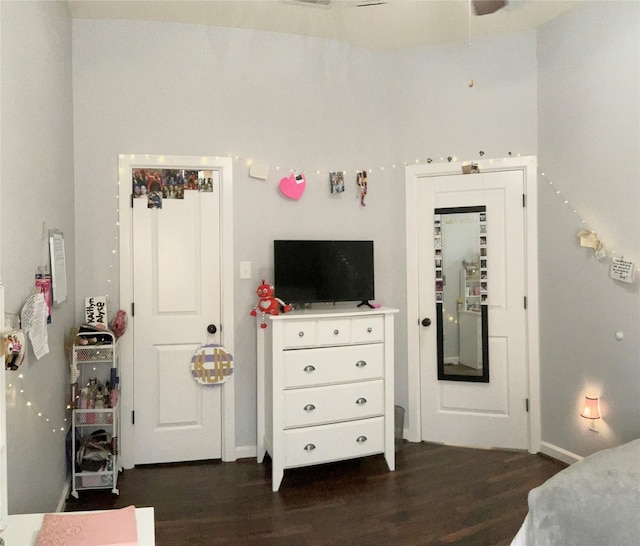 bedroom with dark wood-style floors