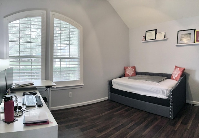 bedroom featuring vaulted ceiling, dark wood finished floors, and baseboards