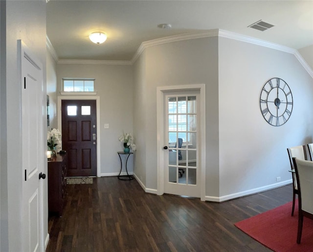 entrance foyer featuring baseboards, dark wood-style flooring, visible vents, and crown molding