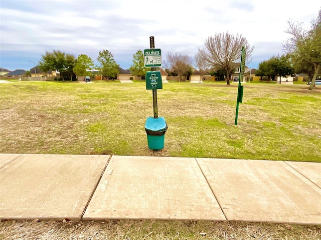 surrounding community featuring a yard