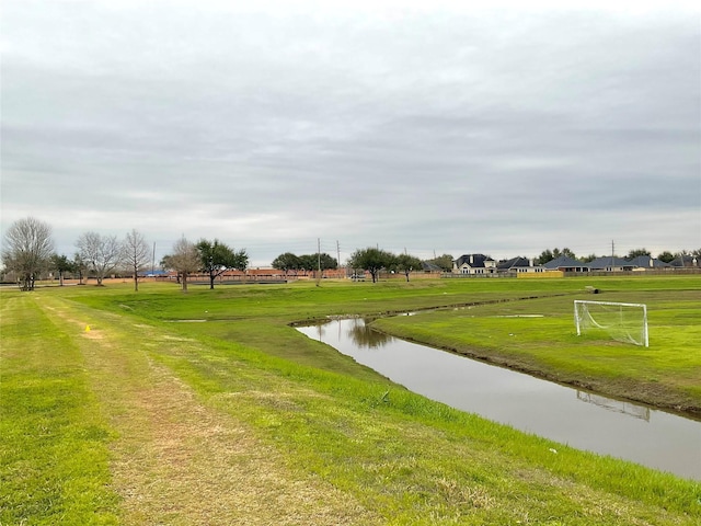 surrounding community featuring a water view