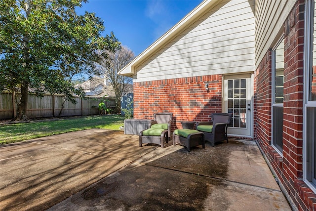 view of patio / terrace featuring fence