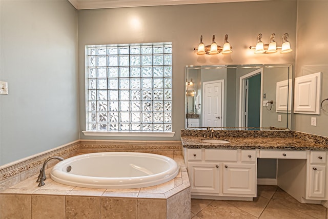 bathroom featuring a garden tub, tile patterned flooring, and vanity