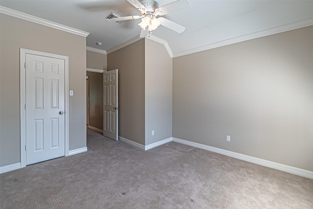 unfurnished bedroom featuring carpet, ornamental molding, ceiling fan, and baseboards