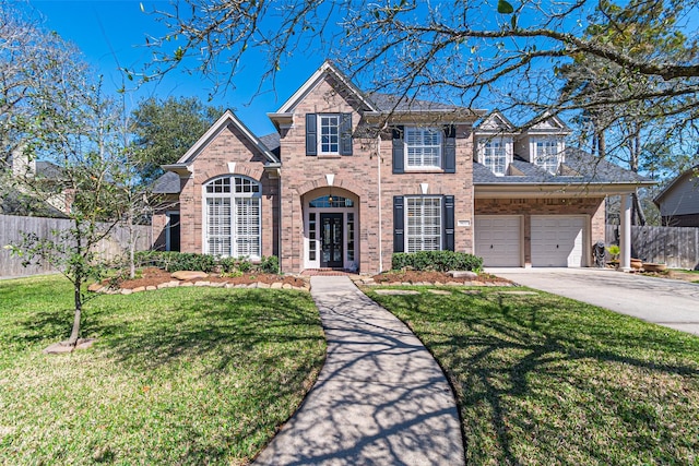 view of front of home featuring a garage, brick siding, concrete driveway, fence, and a front yard