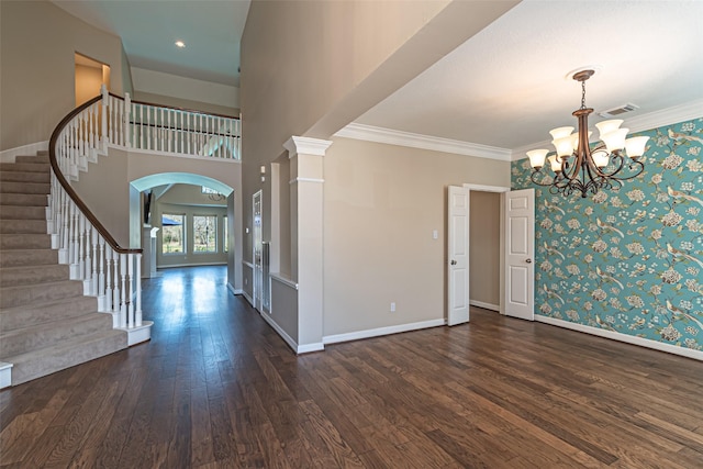 entryway featuring dark wood-style floors, ornamental molding, stairway, and baseboards