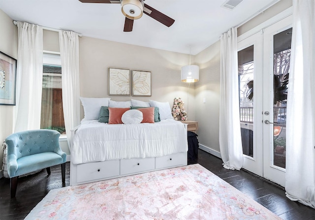 bedroom featuring access to outside, a ceiling fan, visible vents, french doors, and wood finished floors
