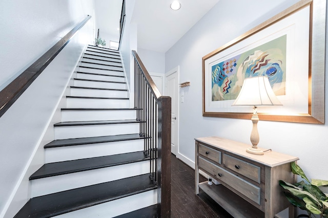 staircase featuring wood finished floors