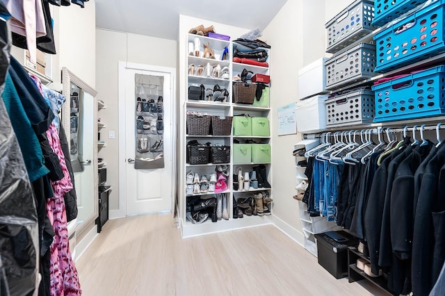 spacious closet with wood finished floors
