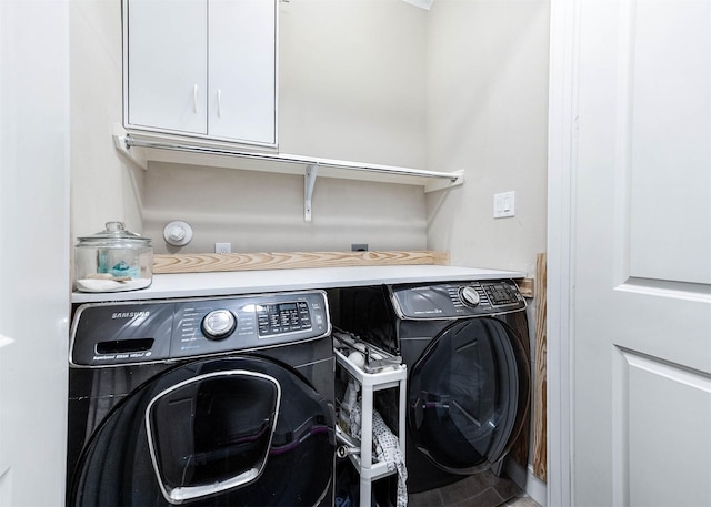 washroom featuring washer and dryer