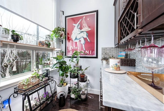 interior space featuring backsplash and baseboards