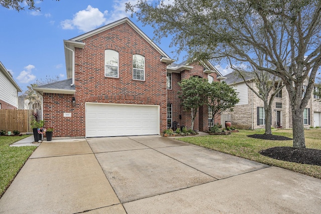 traditional-style home featuring an attached garage, brick siding, fence, driveway, and a front lawn