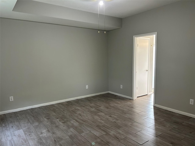 spare room with wood-type flooring