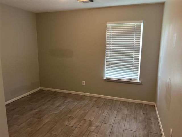 empty room with wood-type flooring