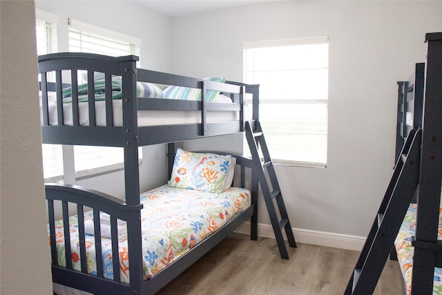 bedroom with hardwood / wood-style flooring