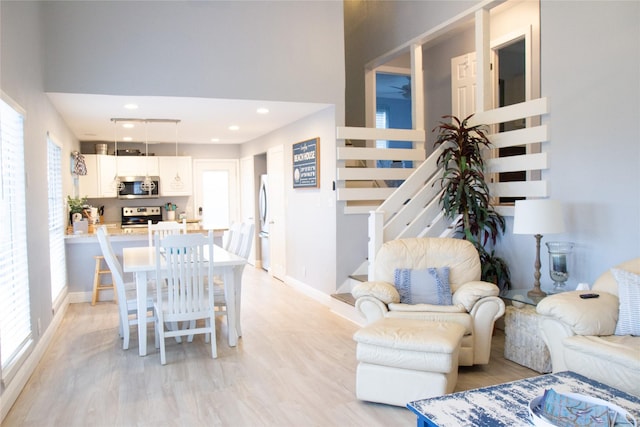 living room with light hardwood / wood-style floors