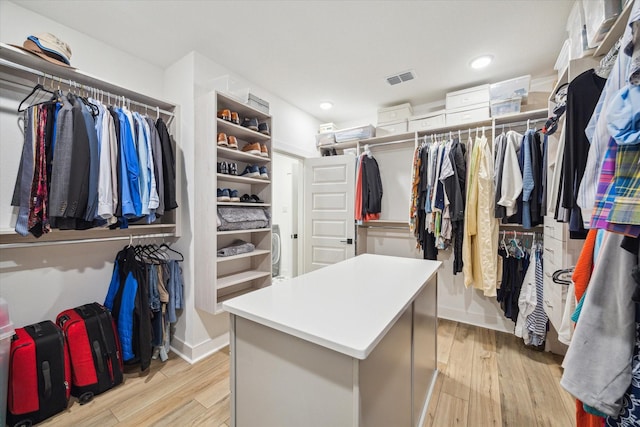 spacious closet featuring light hardwood / wood-style flooring