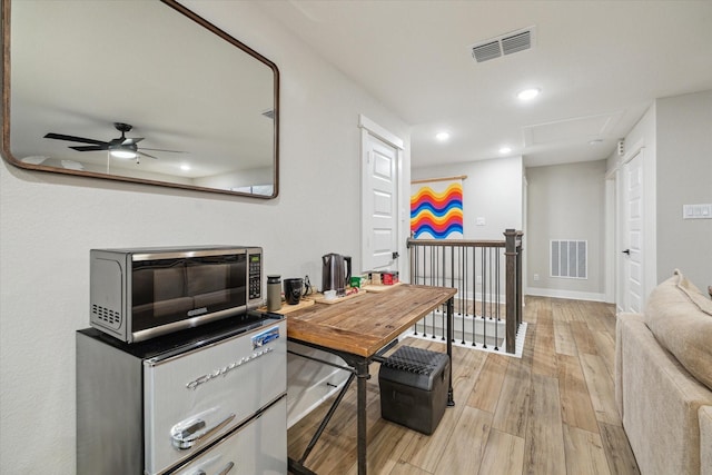 office featuring ceiling fan and light wood-type flooring